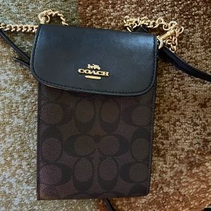 Coach wallet with gold chain.